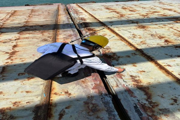 Haiphong Marine technical carries out leaking test hatch cover on board at Campha anchorage